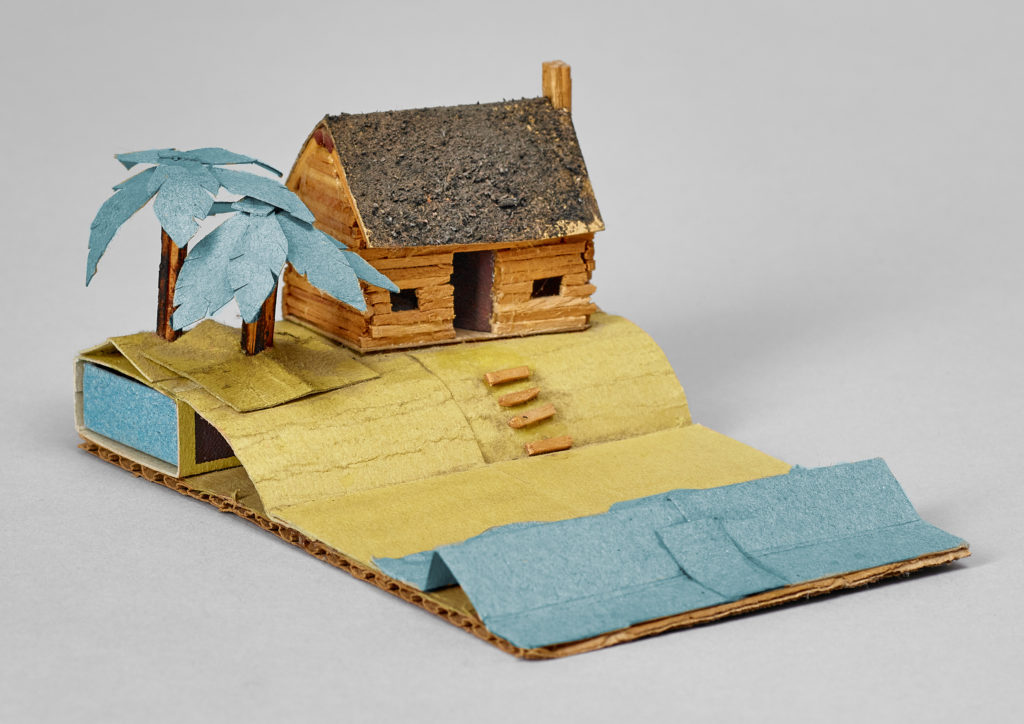 A beach scene made using only contact adhesive and a few boxes of matches.